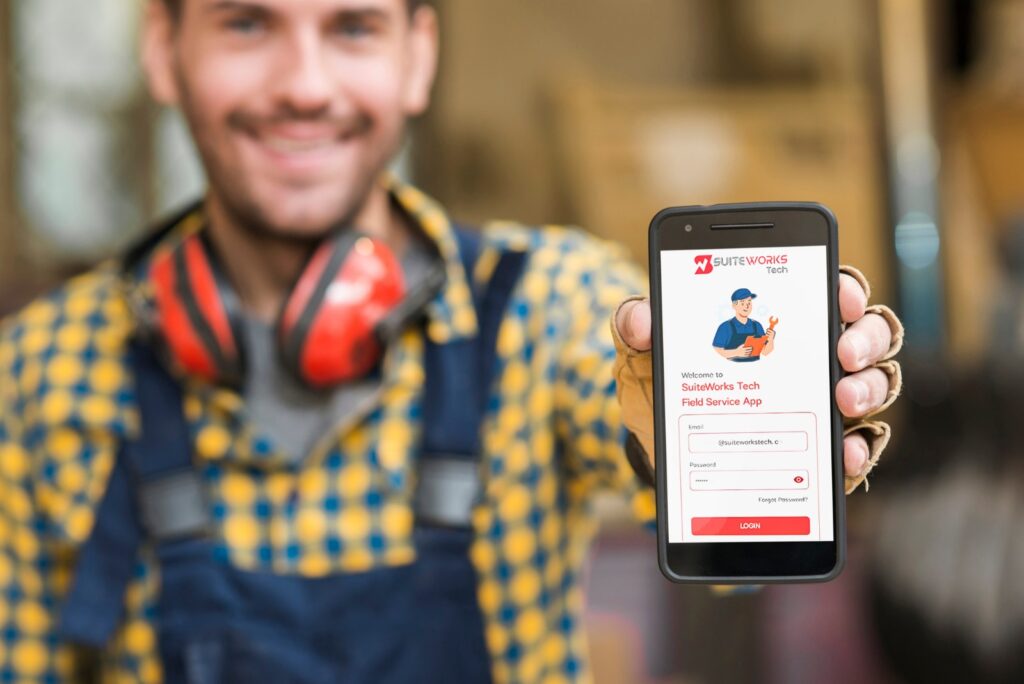 Technician using NetSuite Field Service Management Mobile App in the field
